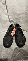 Pair of black leather Vans Chukka Del Barco shoes with tags visible