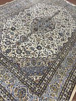 Oblique close view showing central medallion and floral field