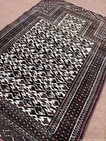 Full view of Torkaman rug showing entire design and fringe