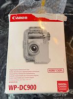 Front of Canon WP-DC900 retail box showing product image and branding