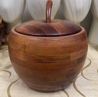 Front view of banded wooden apple ice bucket with lid and stem handle visible