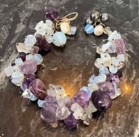 Full bracelet laid flat showing gemstone and pearl beads with clasp