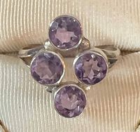 front view showing four bezel-set amethysts on ring