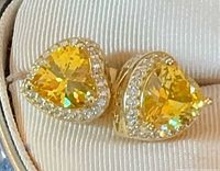 Pair of gold-plated sterling silver heart stud earrings with yellow center stones and CZ halo