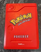 Front closed view showing Pokémon logo and Pokedex label