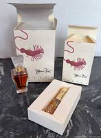 Full shot of both boxed perfume items with bottles displayed