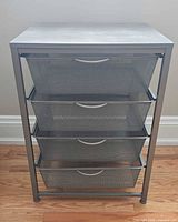 Front view of organizer showing all four mesh drawers closed