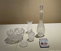 All five cut-crystal pieces grouped together on table