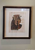 Full view of framed papyrus artwork hung on wall