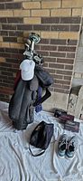 Full lot: stand bag with clubs, hat, shoe bag, shoes, Titleist ball boxes