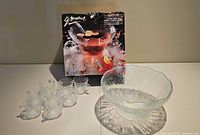 Set displayed with bowl, six cups visible, box in background