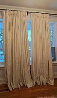 Both curtain panels hanging together showing full length and drape