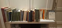 Shelf showing majority of the book spines plus pamphlet Marx Wage Labour and Capital
