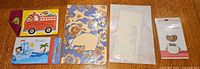 Five sealed Japanese stationery/greeting card sets laid out side by side