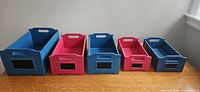 Front view of all five bins showing colors, chalkboard panels and relative sizes