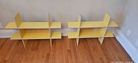 Both yellow laminate shelving units side by side; lot is one unit