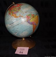 Full view of 10" World Nation Series globe on gold-tone base