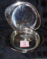stainless tray upright behind tray with glass bowl inserted