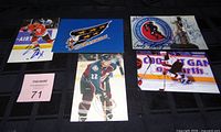 Overview of five autographed hockey items