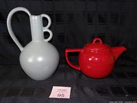 Front view of grey vase and red teapot