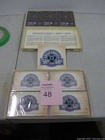 Closed box with four sealed cassettes visible