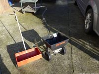 Both spreaders side by side on driveway