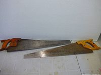 Both hand saws side by side showing full length and handles