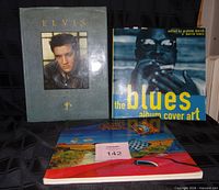 Front covers of all three books upright