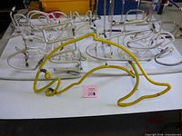 Yellow fish neon tube and clear word-form tubes behind