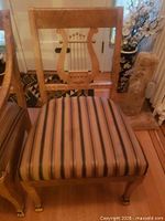 Front view showing full chair, lyre back and striped seat