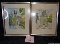 Both framed prints side by side