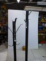 Upper sections showing silver hooks attached to black uprights