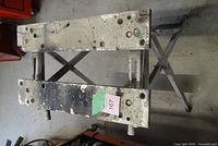 Workbench set up showing top boards, vise jaw holes, adjustment handles