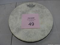 Front view of Remo frame drum showing Fiberskyn head with logo and size reference