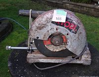 Left side view showing 14" blade guard with Ryobi label and rust