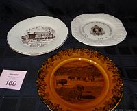 Three commemorative plates arranged together