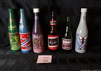 Front view of all six bottles showing graphics and labels