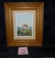 Front view of framed painting showing artwork and mat