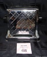 Front view showing chrome diamond-pattern door