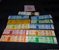 All tickets laid out showing colours, dates and seating print, plus Bruins patch
