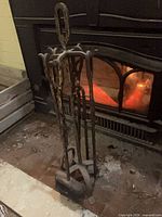 fireplace tool set front view showing four tools on stand