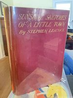 Front view of the 1912 first Canadian edition hardcover with red boards and gilt title