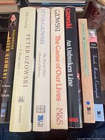 Spine view showing all seven book titles