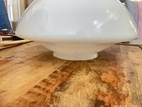 Side profile showing dome shape and base