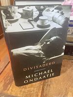 Front of hardcover with dust jacket showing title and author