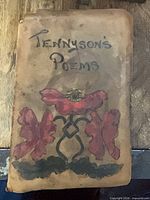 Front cover showing leather wrap and hand-colored illustration