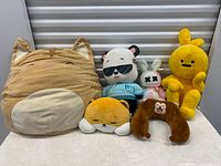 Front view of all six plush items arranged side by side