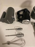 Hand mixer, grey cup, beaters and whisk