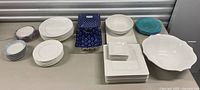 All plates, bowls, casserole, platter and accent pieces displayed on table