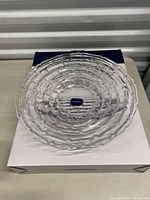 Crystal platter resting on box showing pattern and Mikasa label
